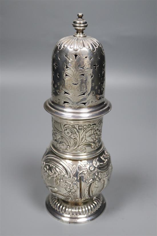 A late Victorian repousse silver sugar caster, Wakely & Wheeler, London, 1896, 20.4cm, 8.5oz.